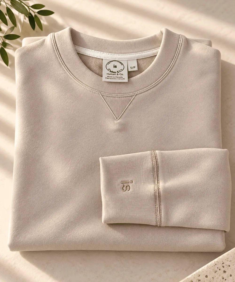 Human and Co. caramel sweatshirt showing the is embroidery on its cuff